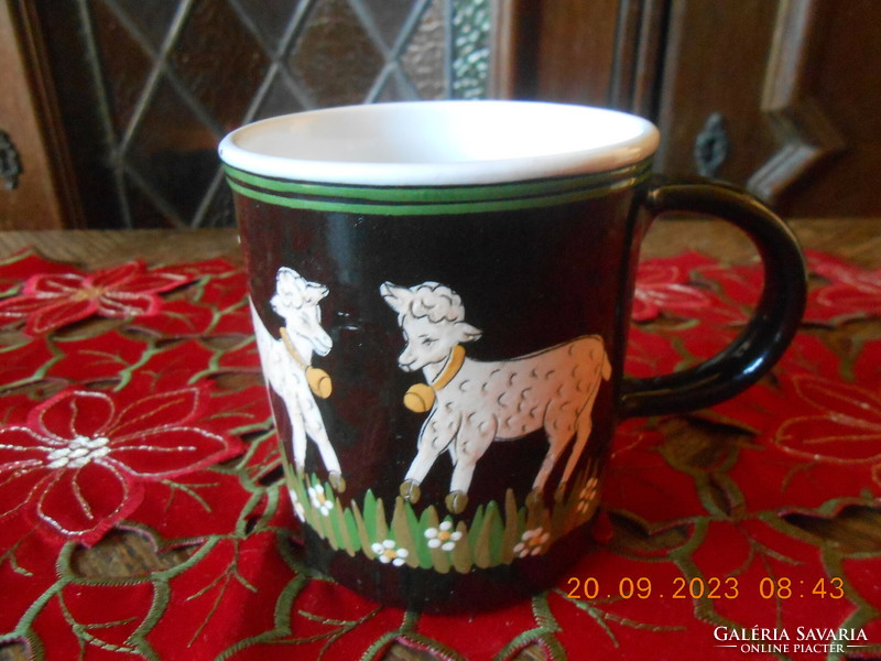 Handmade ceramic mug with hand-painted lamb motifs