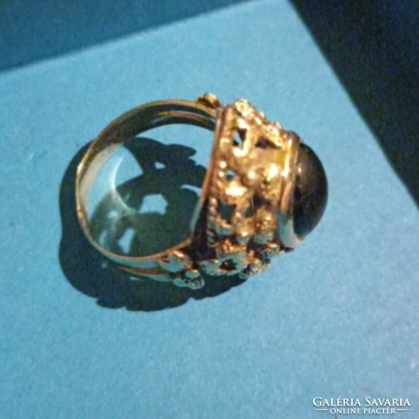 Gold ring with black stones