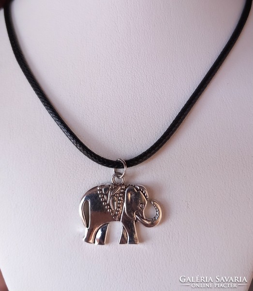 Silver-plated elephant pendant on a black necklace