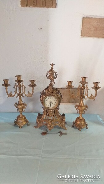 French baroque style bronze mantel clock with two candle holders for sale