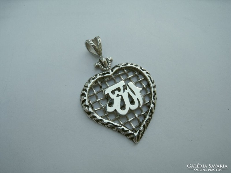 Heart silver pendant with oriental writing
