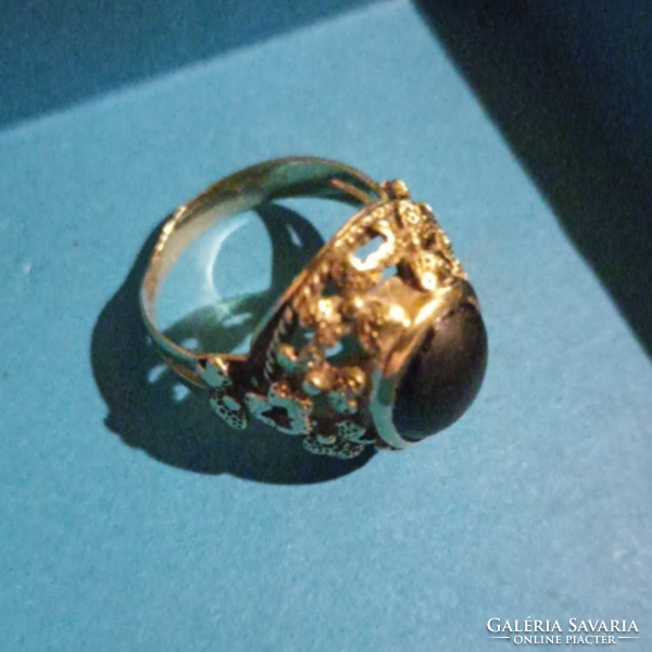 Gold ring with black stones