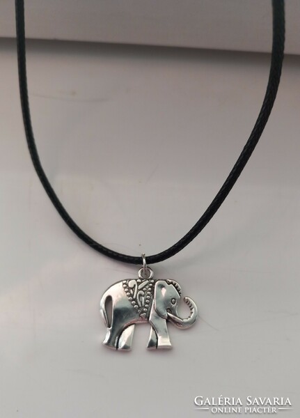 Silver-plated elephant pendant on a black necklace