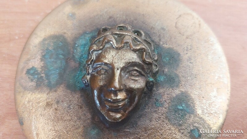 (K) bronze relief