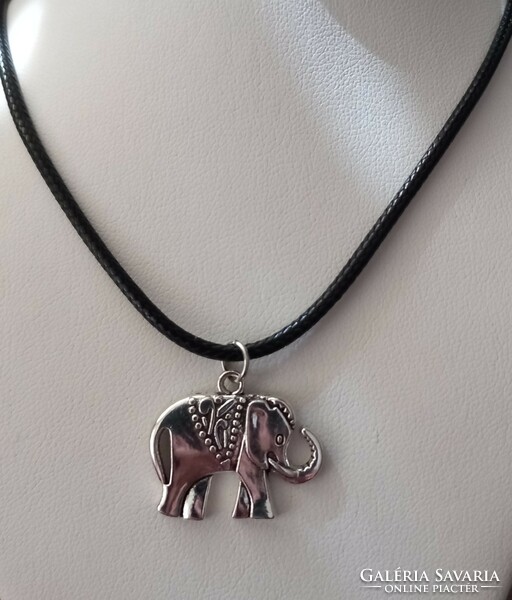 Silver-plated elephant pendant on a black necklace