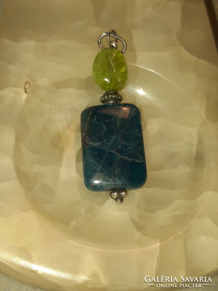 Polished apatite pendant combined with raw aquamarine with silver mounting