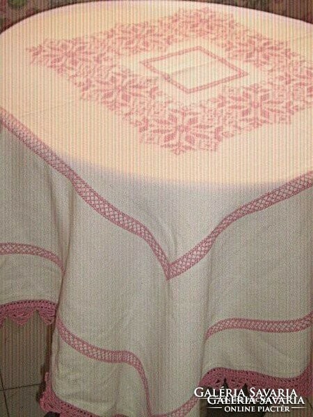 Beautiful hand-embroidered light mauve crocheted cross-stitched tablecloth