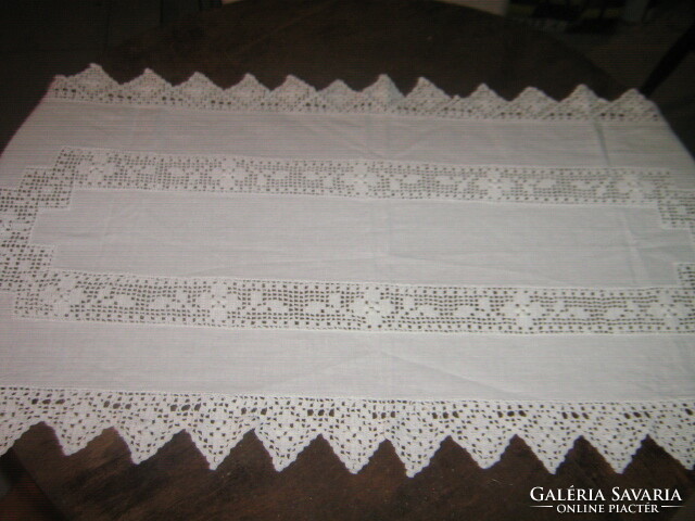 Runner with a beautiful crochet lacy insert and a snow-white tablecloth