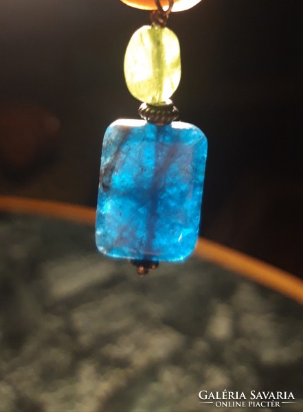 Polished apatite pendant combined with raw aquamarine with silver mounting