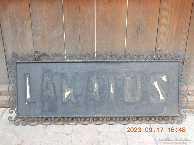 A huge wrought iron company sign