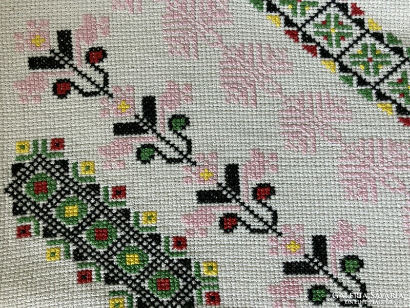 Cross-stitch cushion cover is old