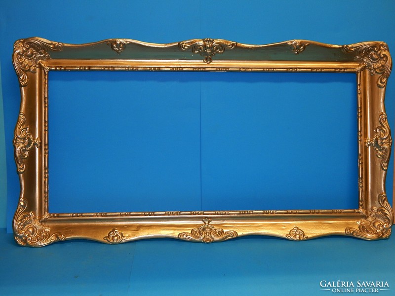 Flawless frame in metallic gold for a 76 x 35 cm picture