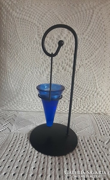 Blue glass candle holder on a black metal stand number 1