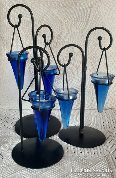 Blue glass candle holder on a black metal stand number 3