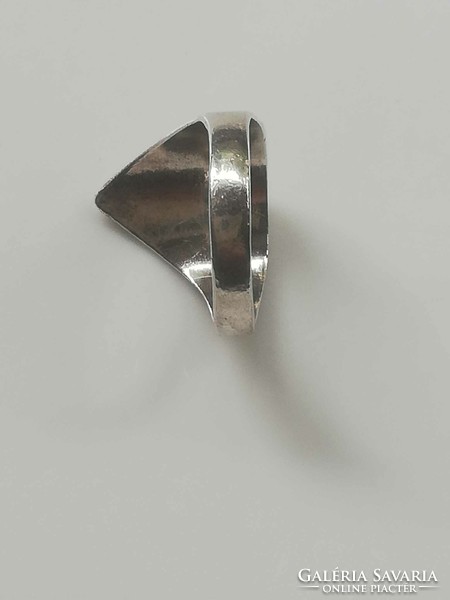 Silver ring with an old mask