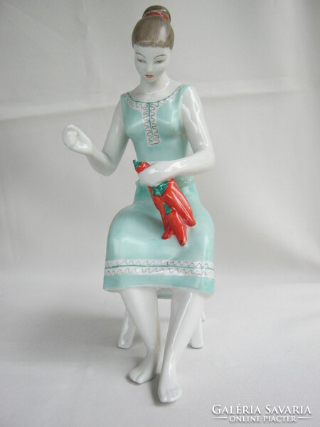 Woman in raven with porcelain pepper