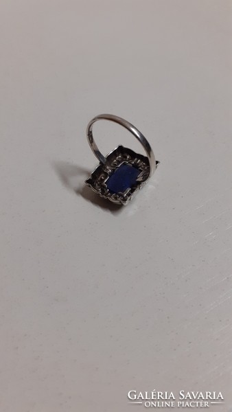Old, beautiful, marked silver ring in a patterned setting, encrusted with a polished lapis lazuli stone
