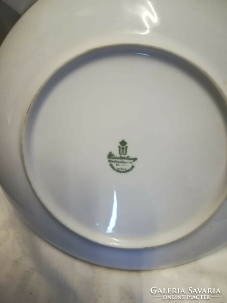 Porcelain decorative plate in a metal frame and its counterpart without a frame