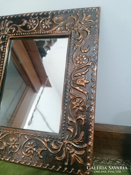 Industrial copper frame wall mirror with a folk motif