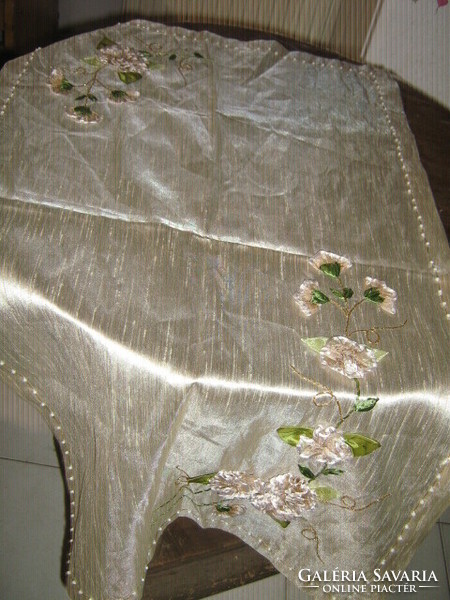 A special floral tablecloth with beautiful handmade ribbon embroidery