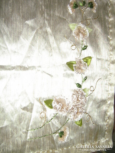 A special floral tablecloth with beautiful handmade ribbon embroidery