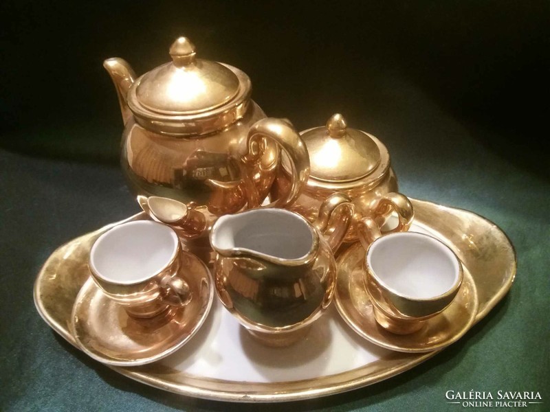 Old, gold-colored, porcelain baby dish, tea set
