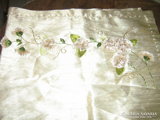 A special floral tablecloth with beautiful handmade ribbon embroidery