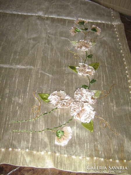 A special floral tablecloth with beautiful handmade ribbon embroidery