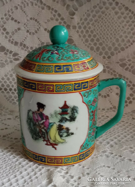 Chinese tea mug with lid.