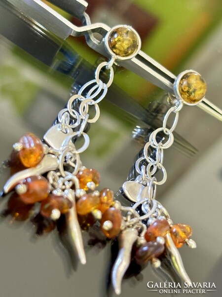 A pair of extreme silver earrings with amber decoration