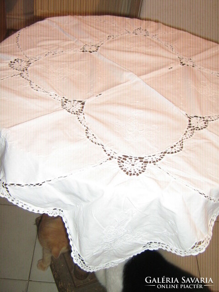 Beautiful handmade crocheted snow-white rosy tablecloth