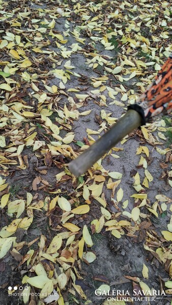 Antique old umbrella with floral pattern in autumn colors