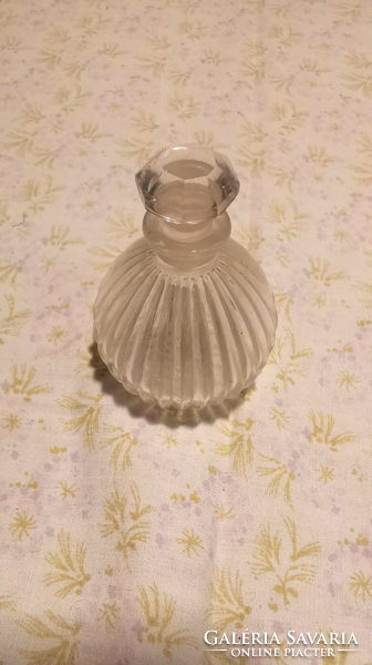 Perfume bottle with polished stopper