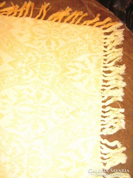 Wonderful baroque patterned woven tablecloth with fringed edges