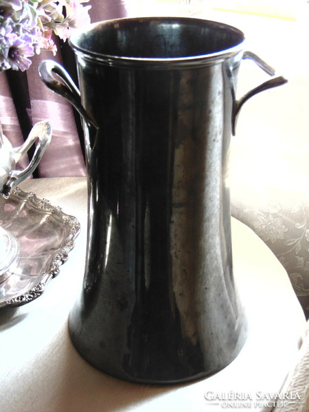 A large, very old champagne bucket with a strong patina