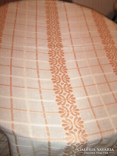 Elegant woven tablecloth with a beautiful cream-colored plaid floral fringed edge