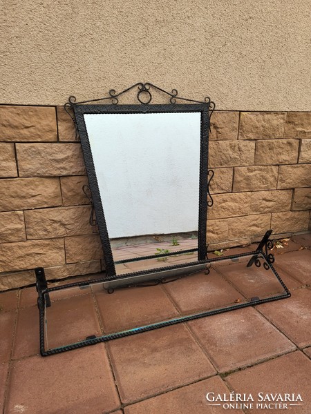 Wrought iron framed wall mirror with glass toilet shelf