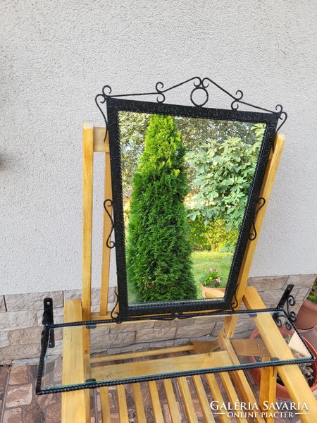 Wrought iron framed wall mirror with glass toilet shelf