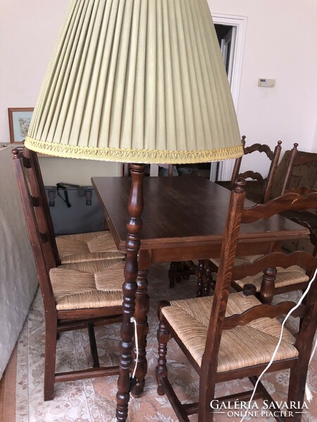 Wooden floor lamp with an olive green lampshade and gold border