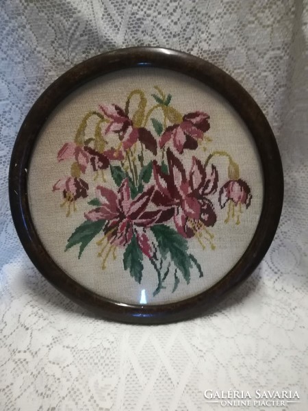 Old tapestry picture, in a round wooden frame