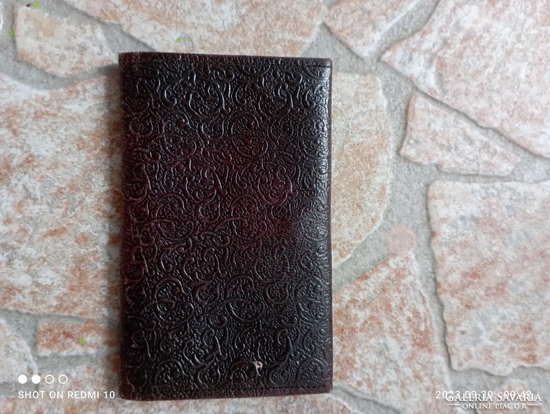 Old filigree, embossed leather file holder