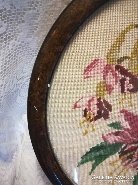 Old tapestry picture, in a round wooden frame