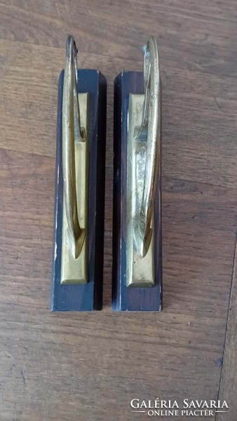 A pair of copper cornice rod holders