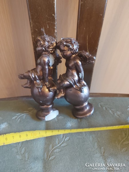 2 bronze-coated putto wax candles