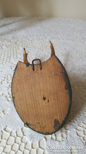 Old deer antler, trophy on a wooden base