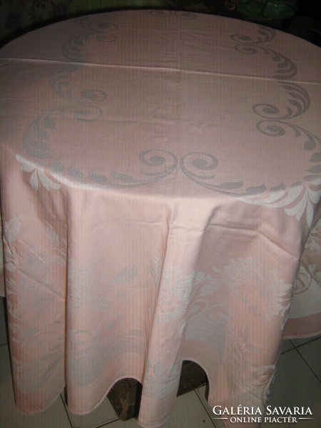 Beautiful baroque floral pattern on antique damask tablecloth