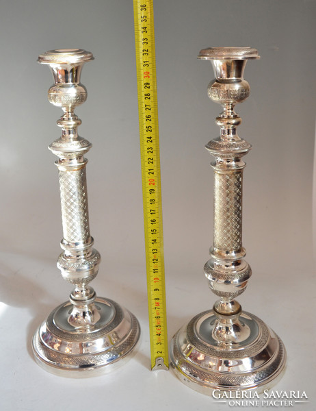 Silver pair of candlesticks with leaf decor