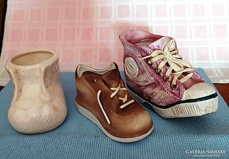 I am selling 3 small ceramic shoes