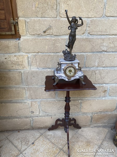 Antique female-shaped fireplace clock with a marble case