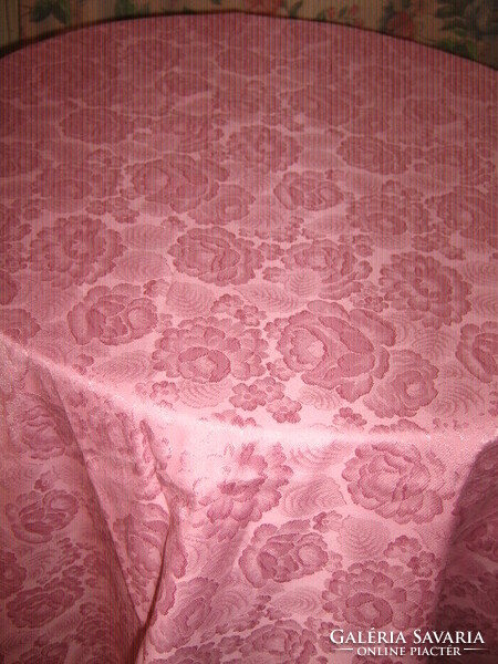 Beautiful vintage full of roses on damask tablecloth